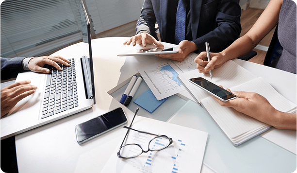 Business meeting with people working on documents